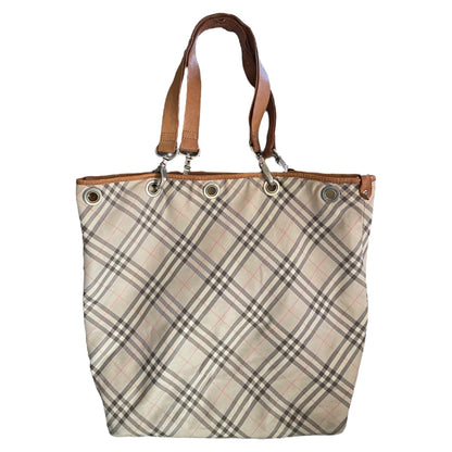 Plaid tote front of bag with brown handles on a white background