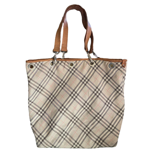 Plaid tote front of bag with brown handles on a white background