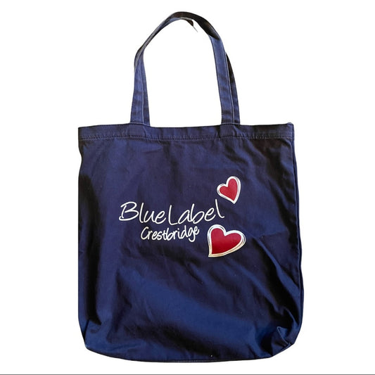 Navy tote bag with 'Blue Label' text and heart designs on a white background