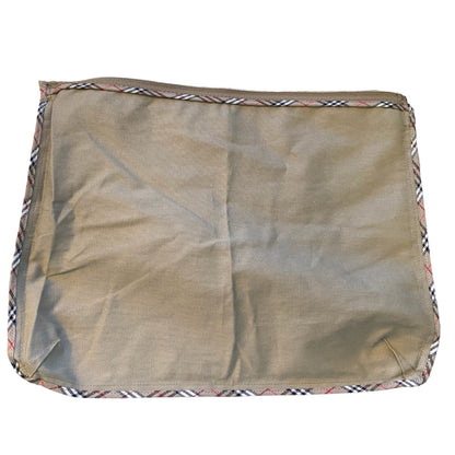 Pouch flipped inside out to show interior with plaid border on a white background