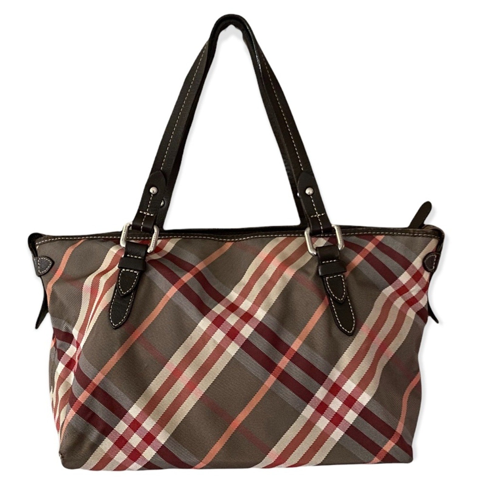 Back of Plaid patterned handbag with brown straps on a white background