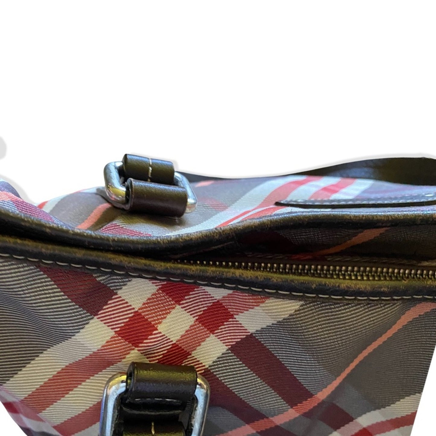 Close-up of a plaid patterned bag with a zipper