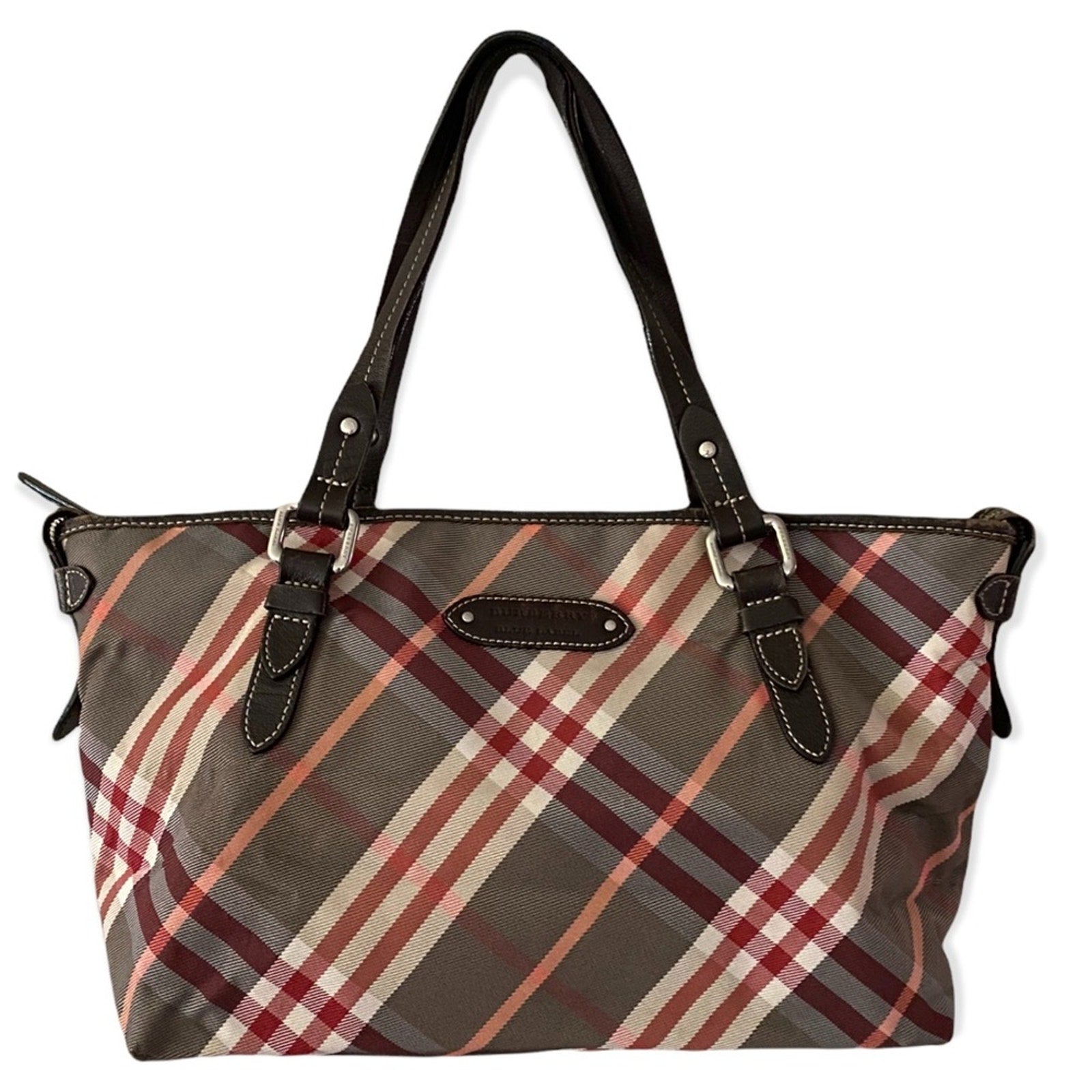 Burberry Plaid patterned handbag with black leather accents on a white background