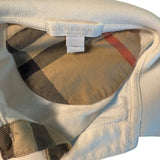 Close-up of a Burberry shirt with check pattern and brand label.