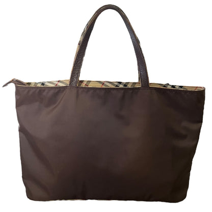 Back of Brown tote bag with plaid interior on a white background