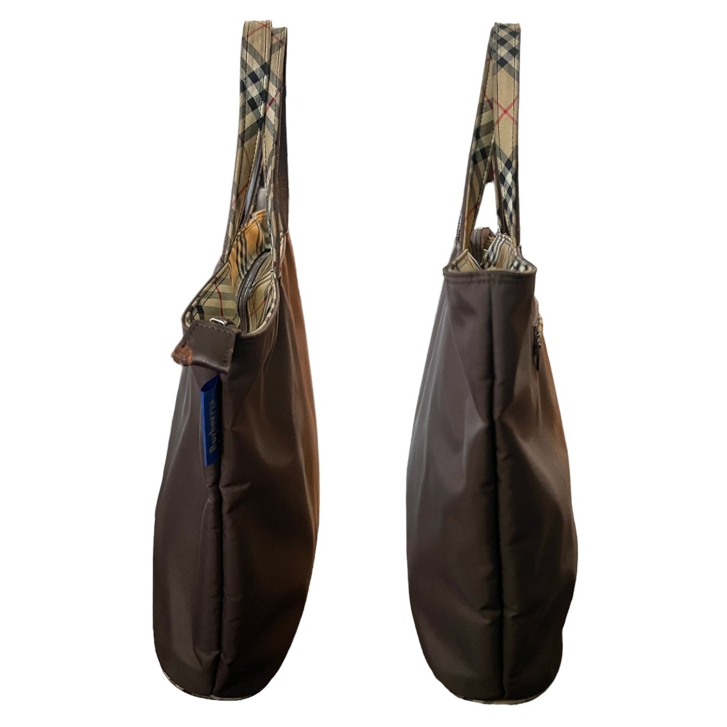 Brown purse sides with plaid handle on a white background