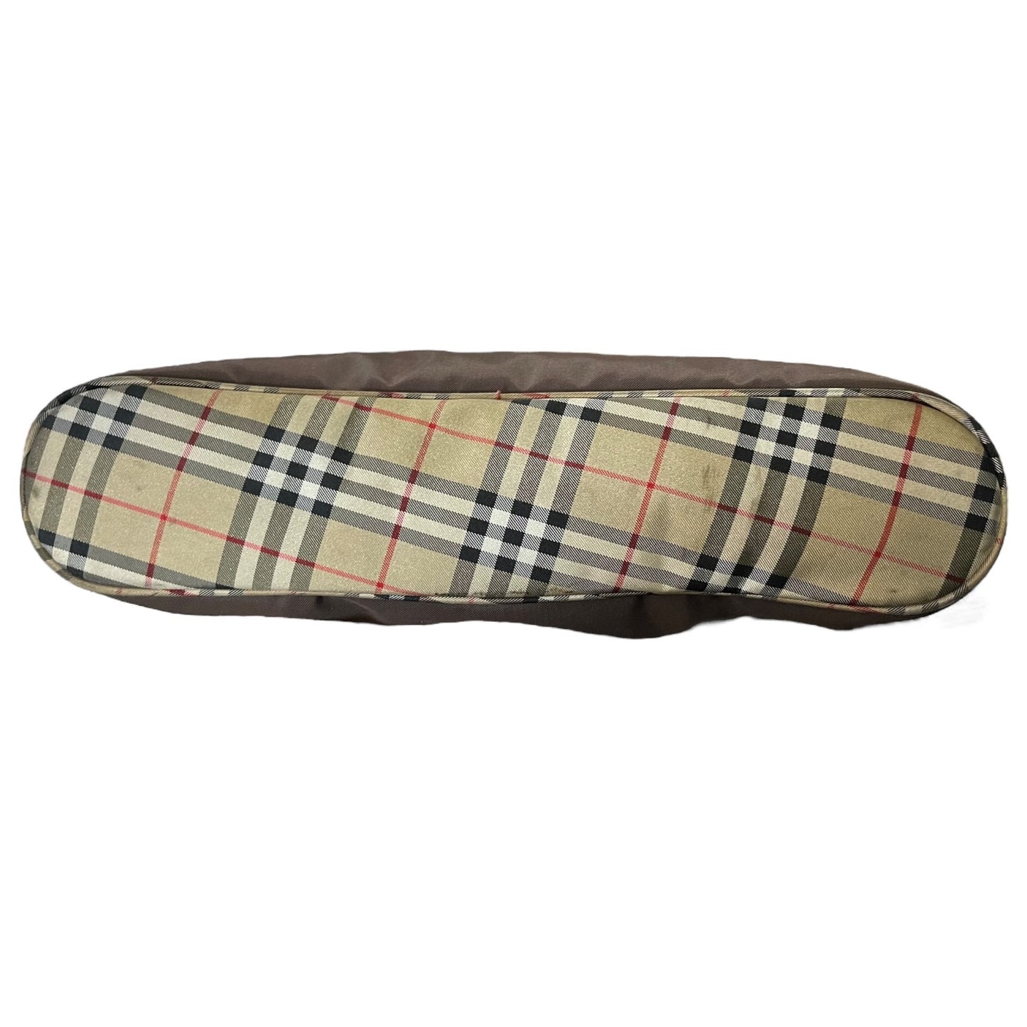 Bottom of brown purse with plaid pattern on a white background