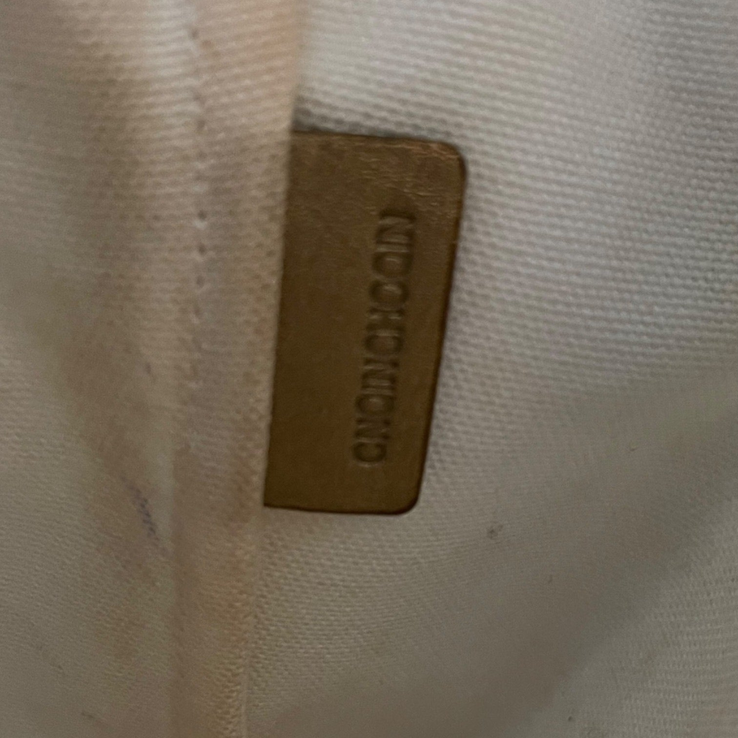 Interior tag on purse