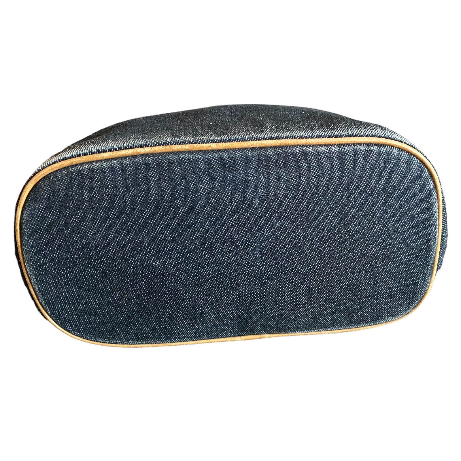 Denim blue bottom of purse with leather trim on a white background