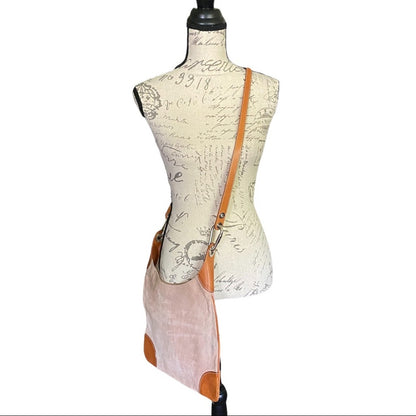 Side view of pink Burberry crossbody purse