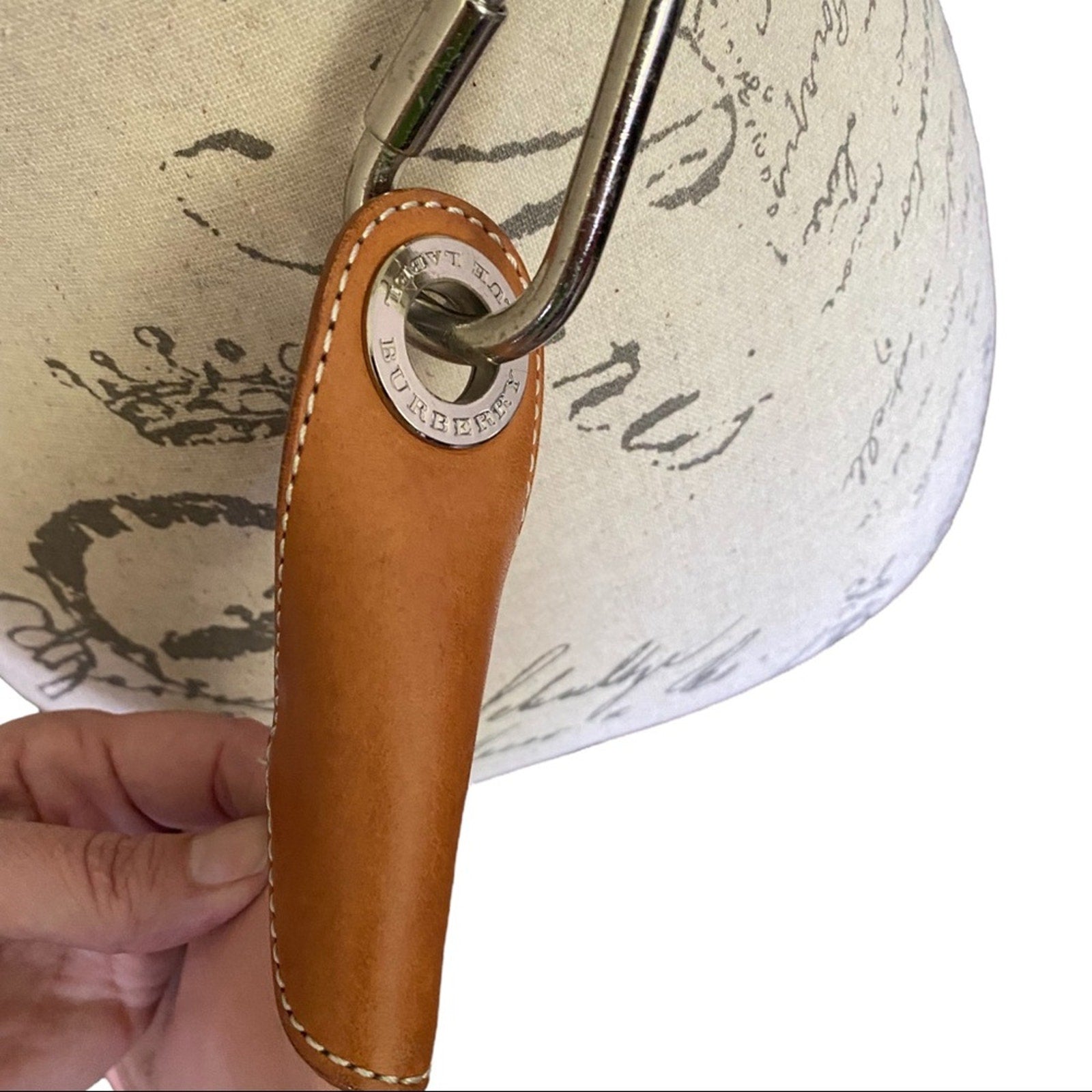 Leather side of pink Burberry crossbody purse