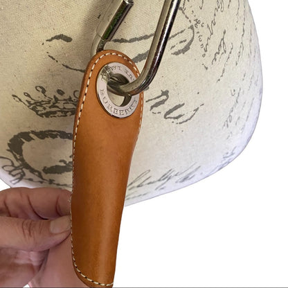 Leather side of pink Burberry crossbody purse