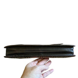 Bottom of Burberry portfolio clutch 