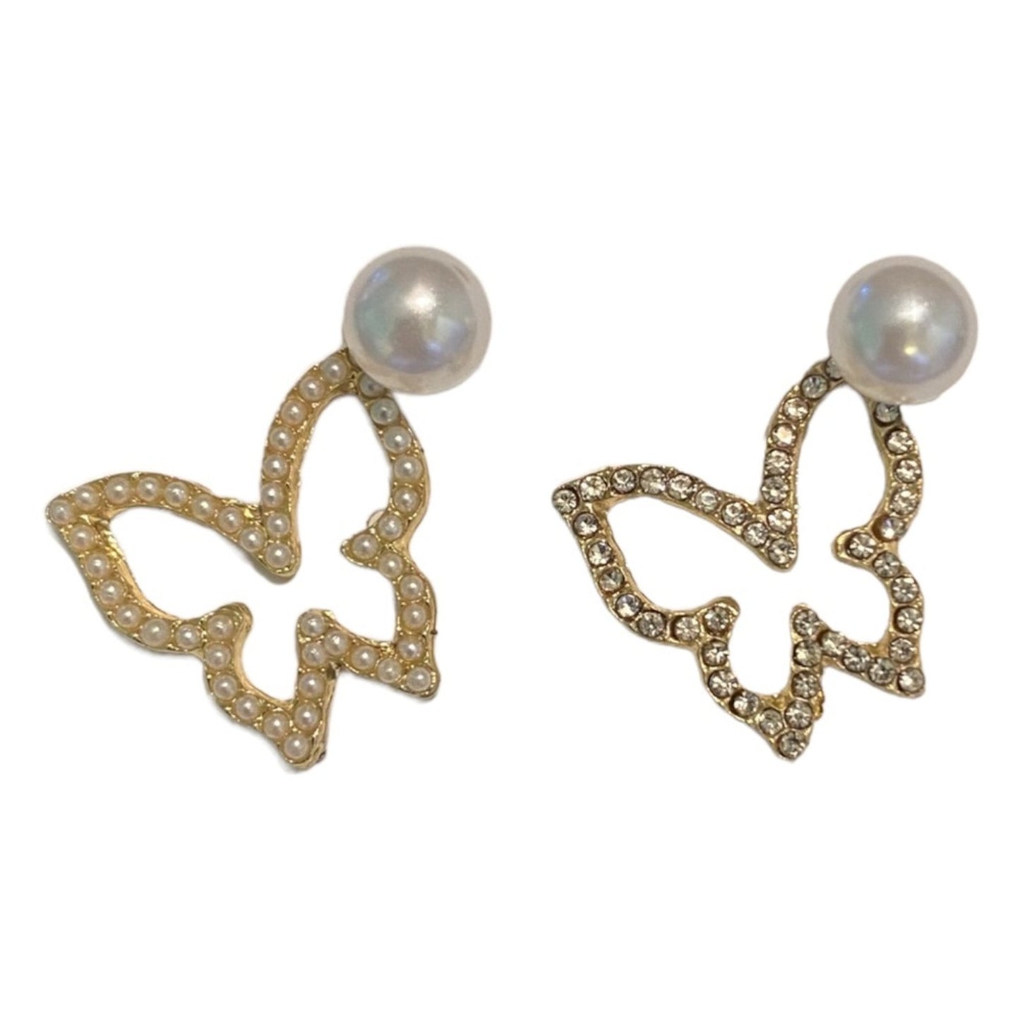Butterfly-shaped earrings with pearl centers on a white background