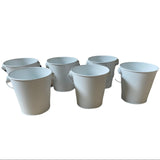 Front of 6 pails with handles down