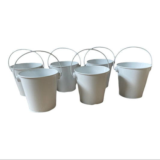 Six white metal pails with wire handles arranged together on a plain white background.