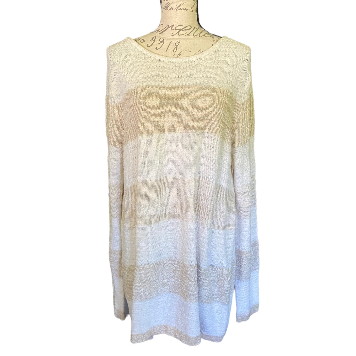 Front of knit striped long sleeve sweater top on a mannequin with a white background