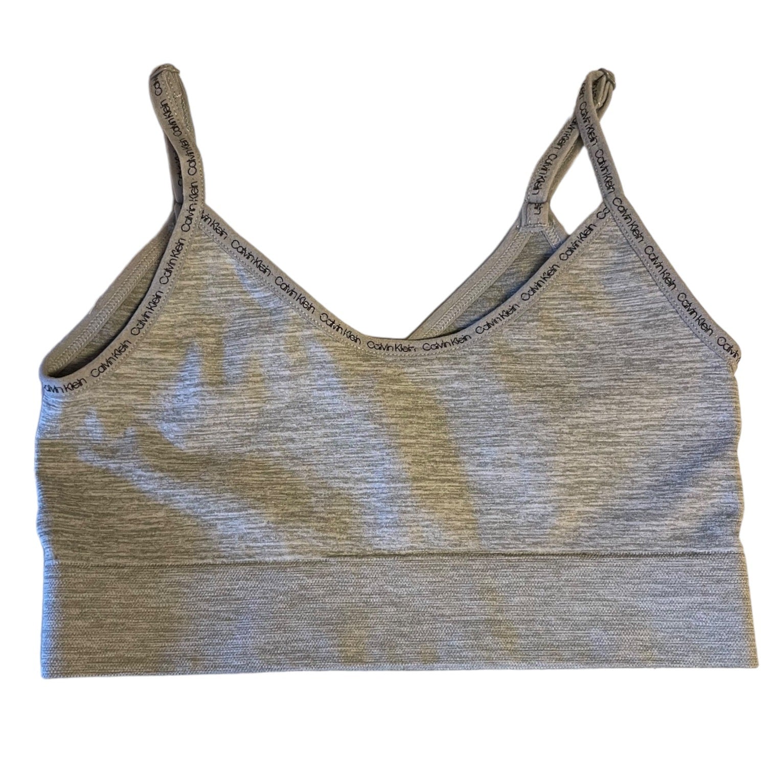 Gray sports bra with Calvin Klein branding on a white background
