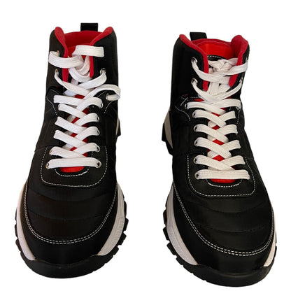 A pair of black high-top lace-up shoes with white laces, white stitching, and red lining details, shown from a front-facing perspective on a white background.