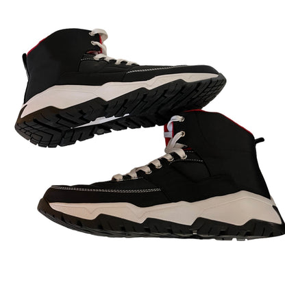 A pair of black high-top sneakers with chunky off-white midsoles and black lugged soles, shown from side and bottom angles on a white background.