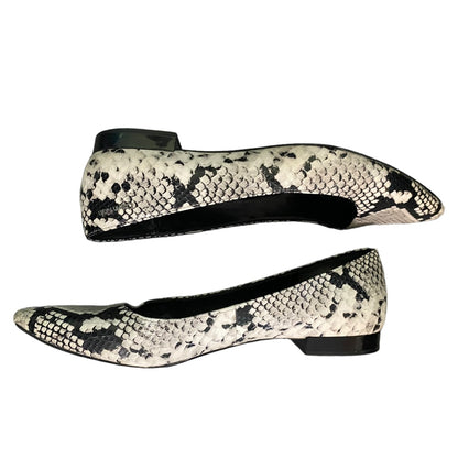 A pair of pointed-toe flat shoes with a black and off-white snakeskin pattern, shown from side and top angles against a plain white background.