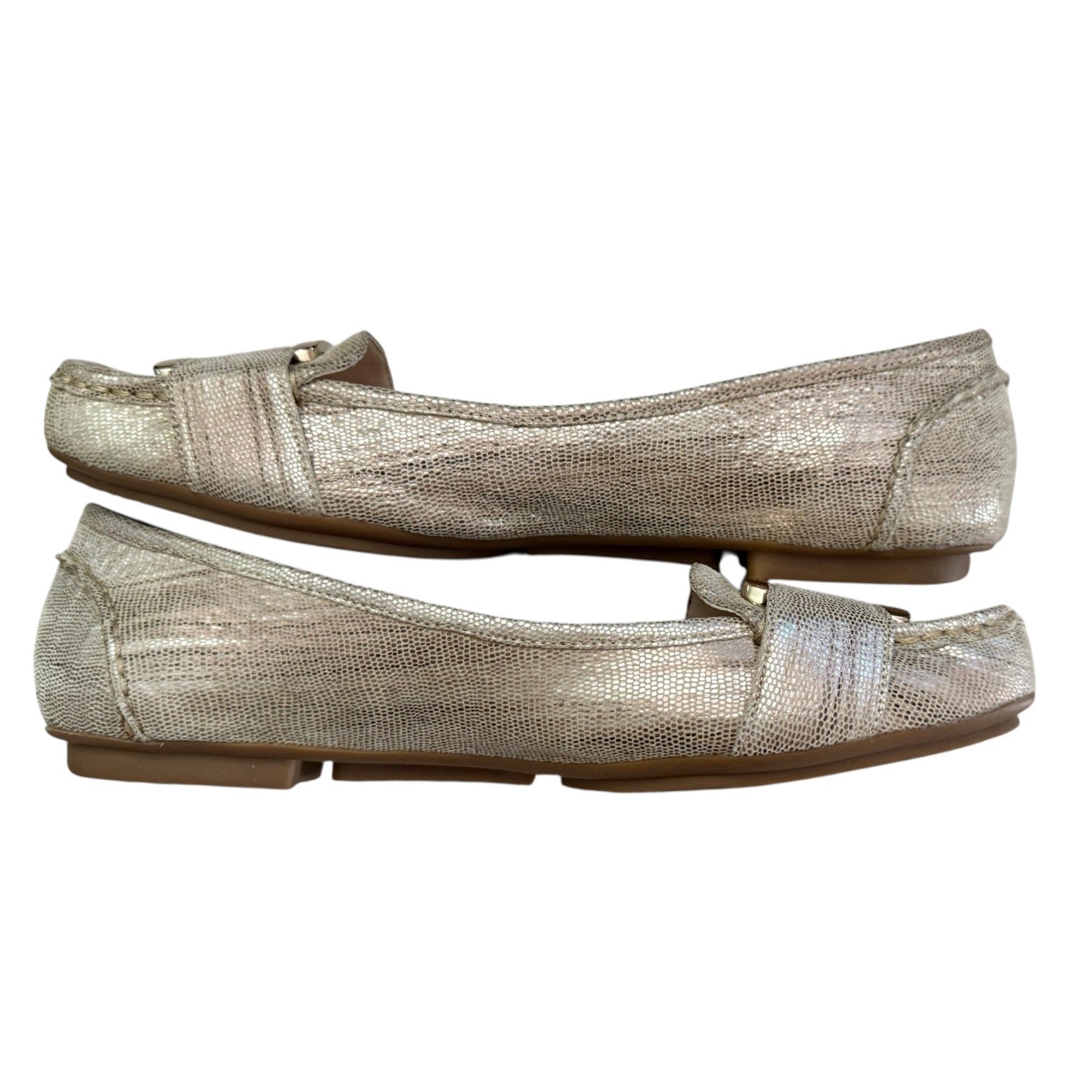 Side of gold flats on a white background