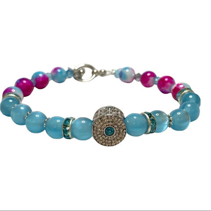 Bracelet with blue and pink beads on a white background