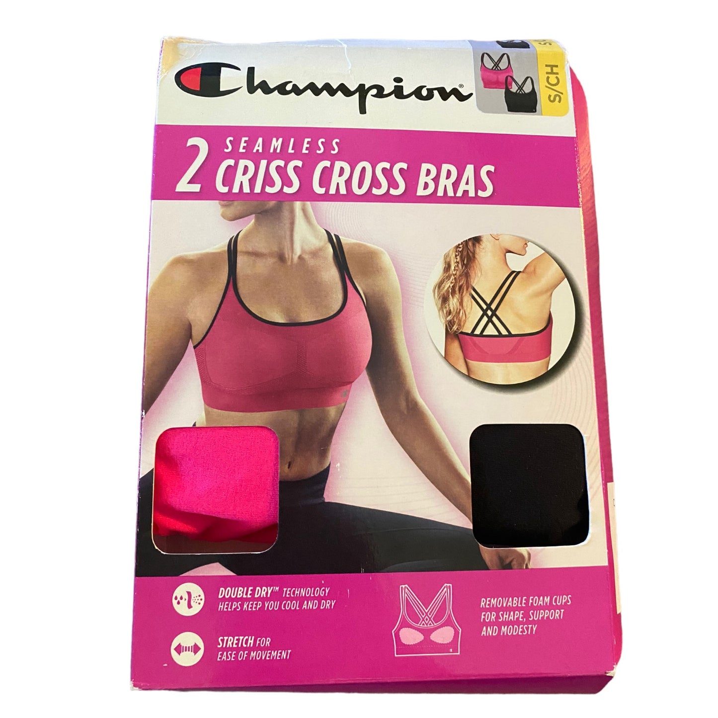 Champion brand packaging of two criss cross bras in pink and black on a white background.