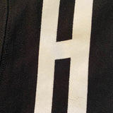 Details on white print of black sweatshirt