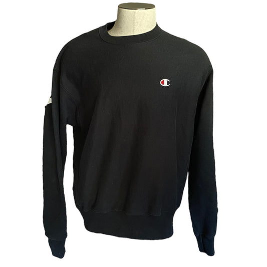 Front of Black sweatshirt with a small logo on a mannequin against a white background
