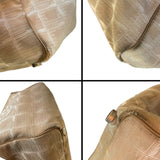 Corners of CC beige purse with dirt marks