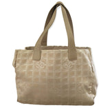 Beige tote bag with a grid pattern on a white background