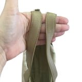 Hand holding a khaki strap against a white background