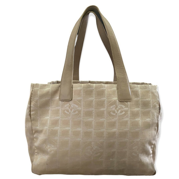 Beige tote bag with a subtle pattern on a white background