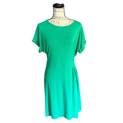 A green short-sleeve dress displayed on a dress form mannequin against a plain white background.