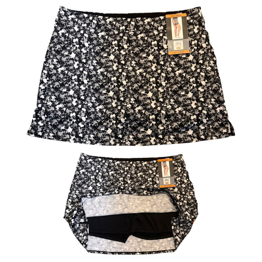 Floral patterned skort with tags on a white background