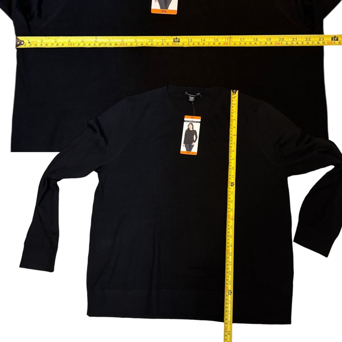 Black long-sleeve shirt with a measuring tape and tag on a white background