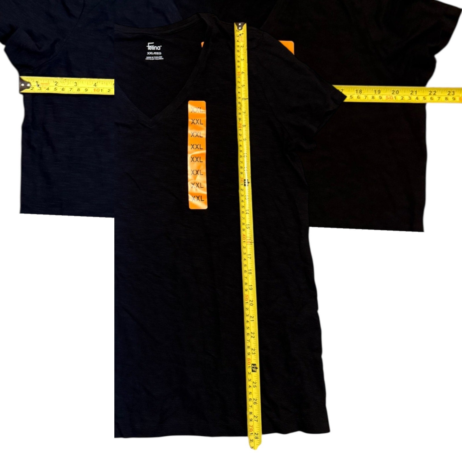 Black t-shirt with a measuring tape displayed on a white background