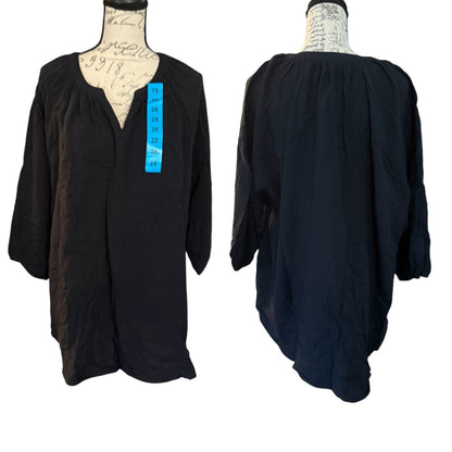 Black long-sleeve dress on a mannequin with a white background