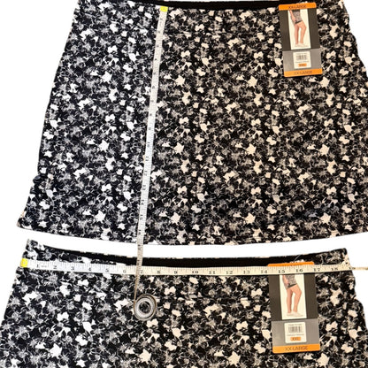 Floral patterned skort with measuring tape and tags on a white background