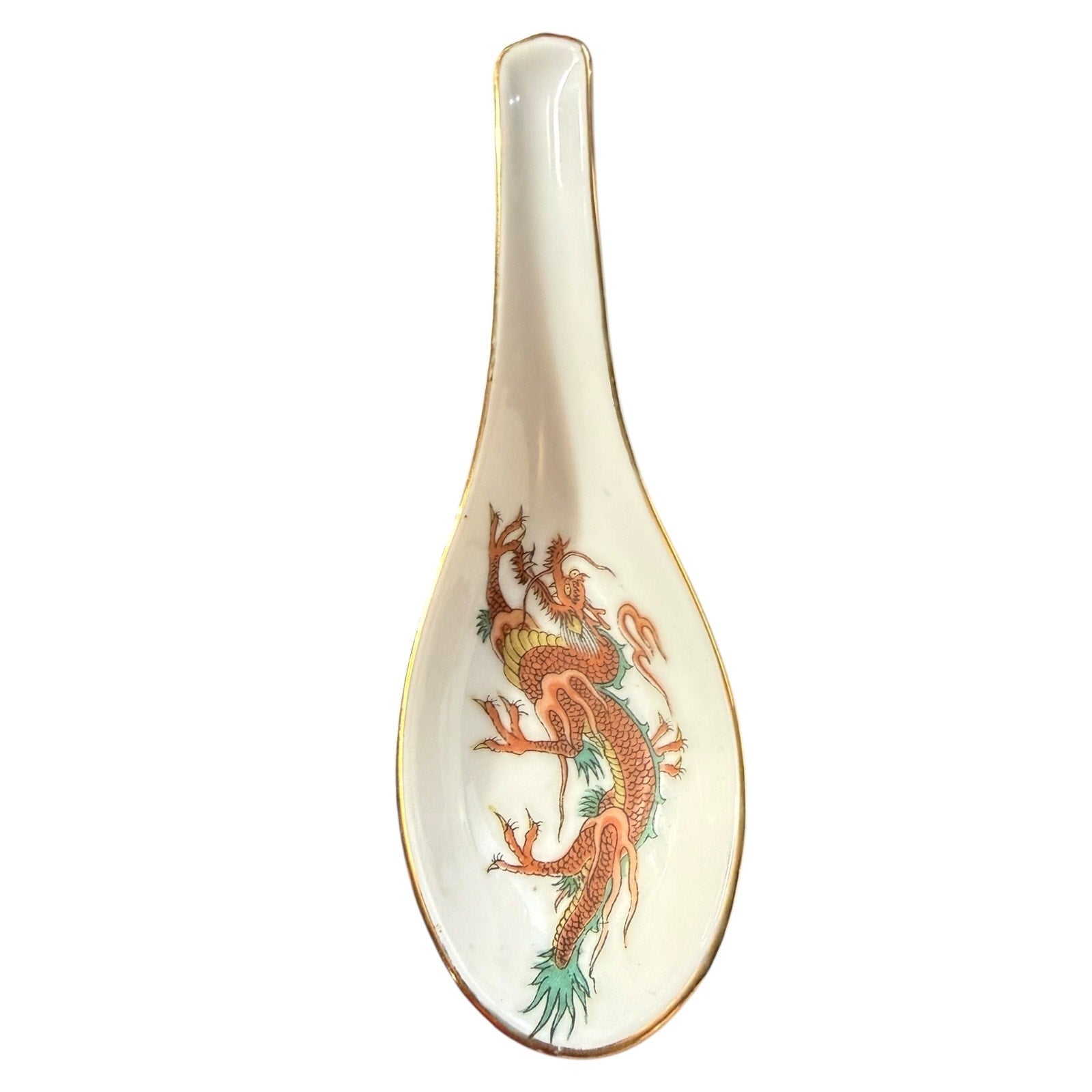 Spoon with dragon design on a white background