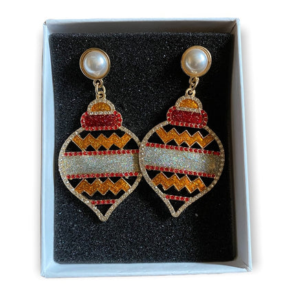 Decorative earrings with geometric holiday patterns in a box