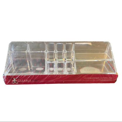 A 14-compartment clear acrylic cosmetics tray wrapped in protective plastic, resting on a red branded base box. The product is photographed against a plain white background.