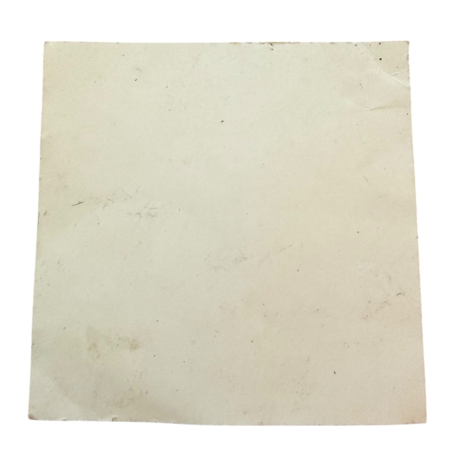 Back of sticker showing dirt and marks on a white background
