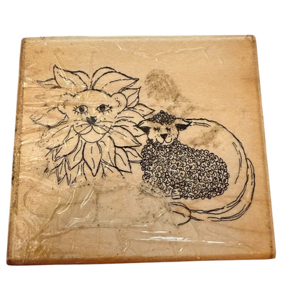 Wooden block with engraved design of a lion and lamb rubber stamp