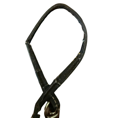 Black leather strap with damage on a white background