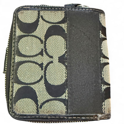 Small wallet with a CC patterned design on a white background