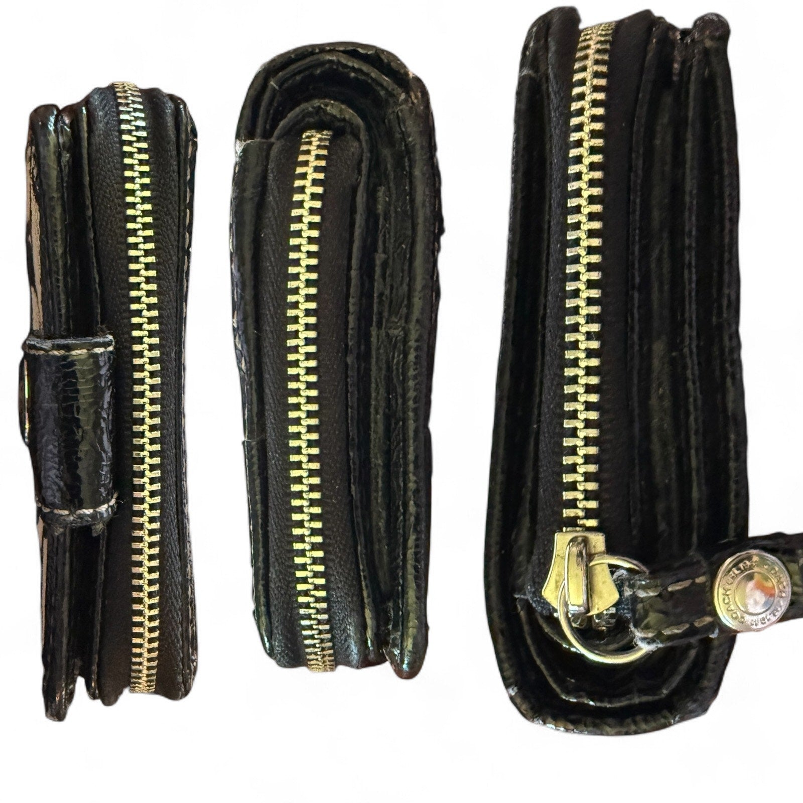 Black leather wallet side view with silver zipper on a white background