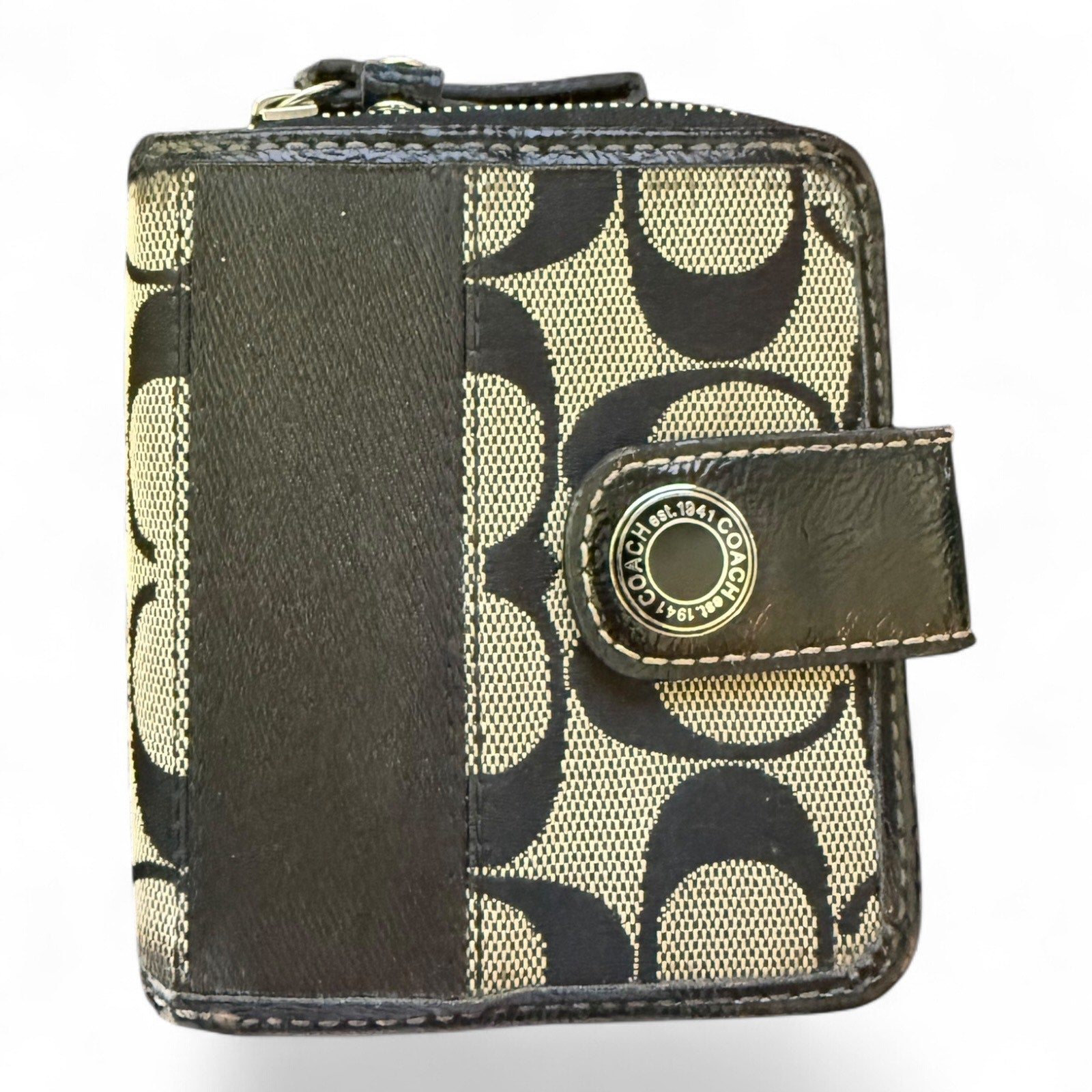 Black CC patterned wallet with a prominent brand logo on a white background