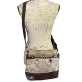 Beige and brown purse with CC pattern on a mannequin